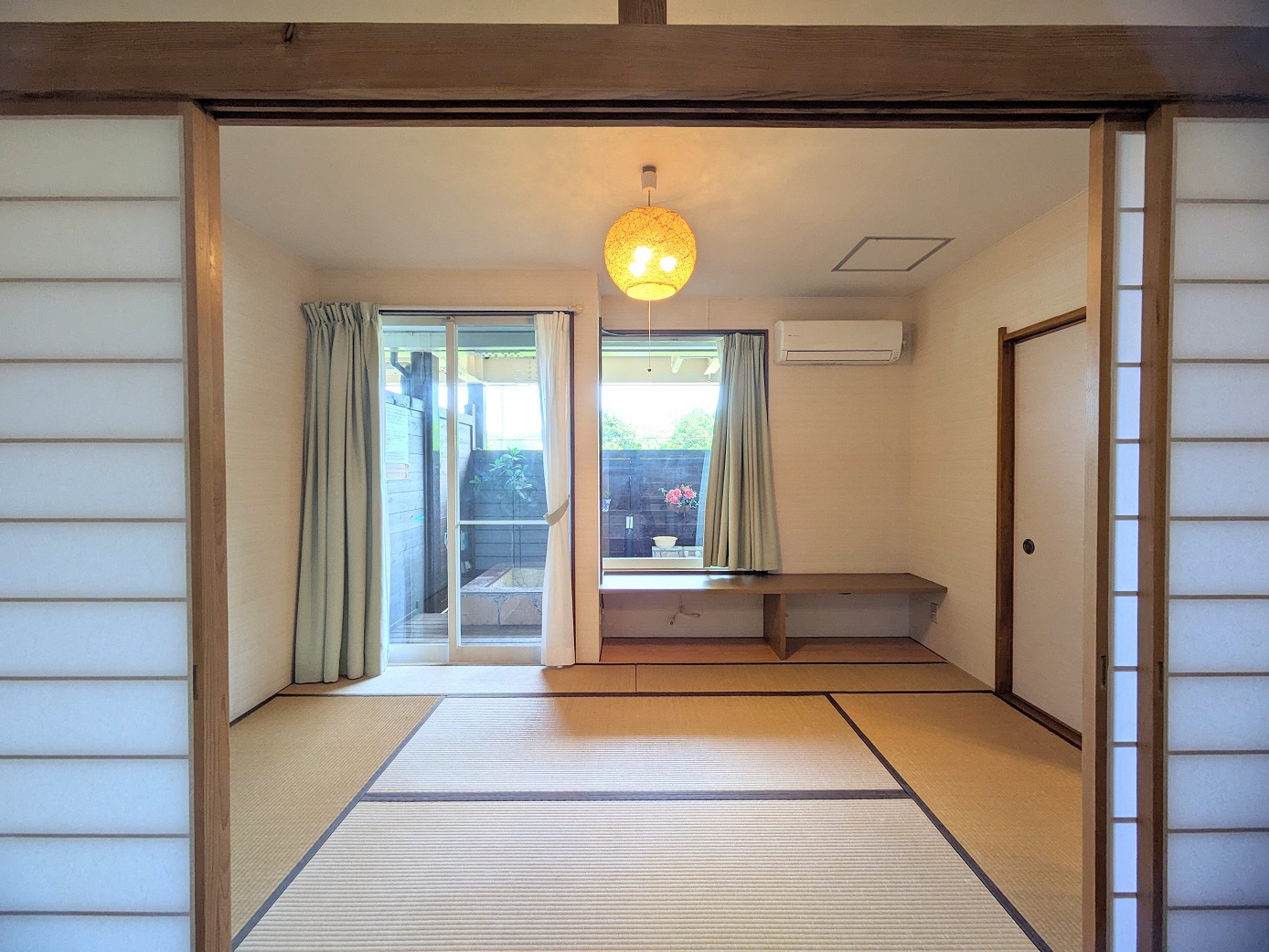 The tatami room — futons; it adjoins the bedroom behind sliding doors.